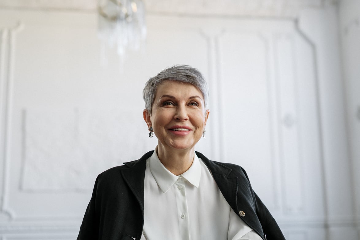 Smiling Woman in Black Blazer